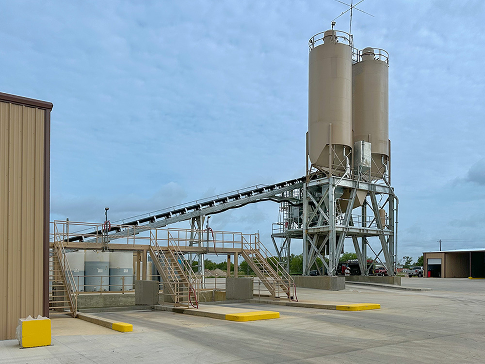 Two chisel nose silos, standard equipment with the Advantage 250 concrete batch plant from concrete plant manufacturer, CMQ Engineering.