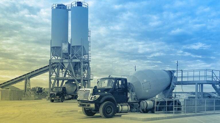 A ready mix concrete batch plant and mixer trucks