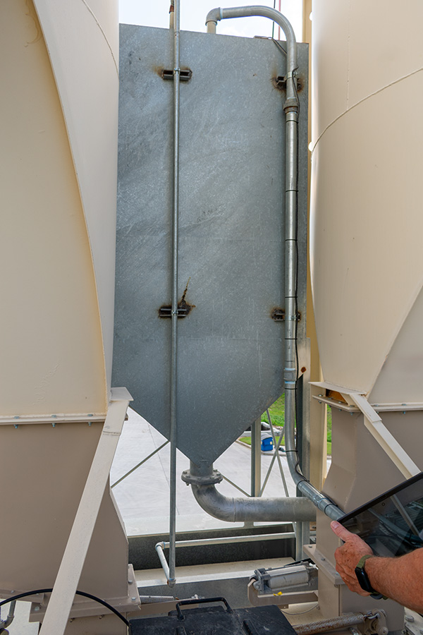 Holding tank for weighed water system at a ready mix concrete plant.