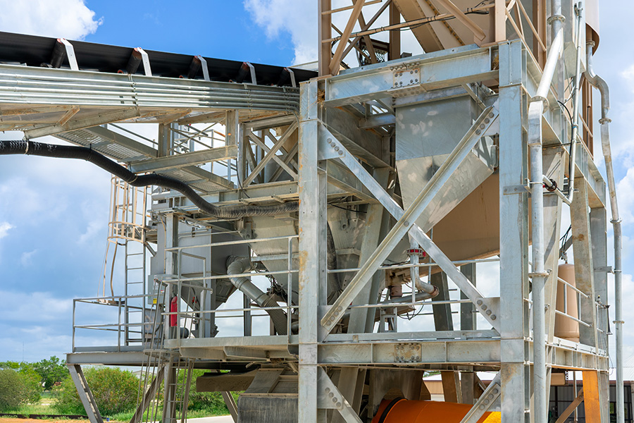 Detailed view of weighed aggregate holding hopper and weighed water system for ready-mix concrete.