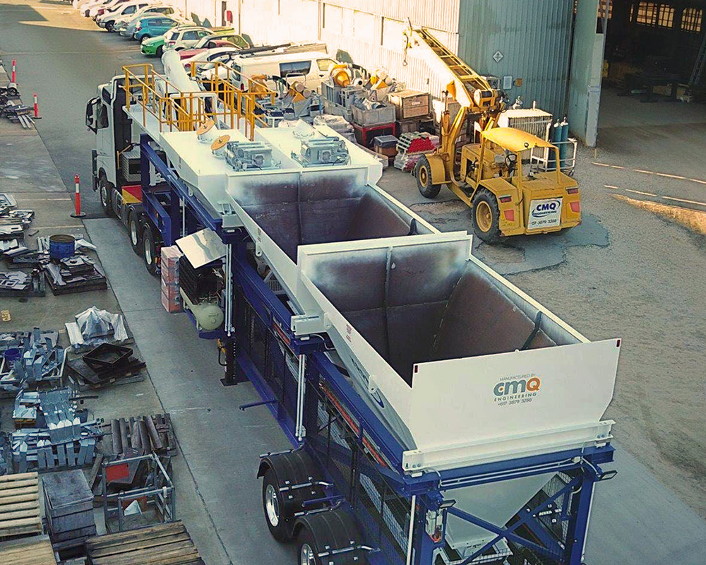View of DualBatch portable concrete plant, showing the aggregate weigh hoppers.